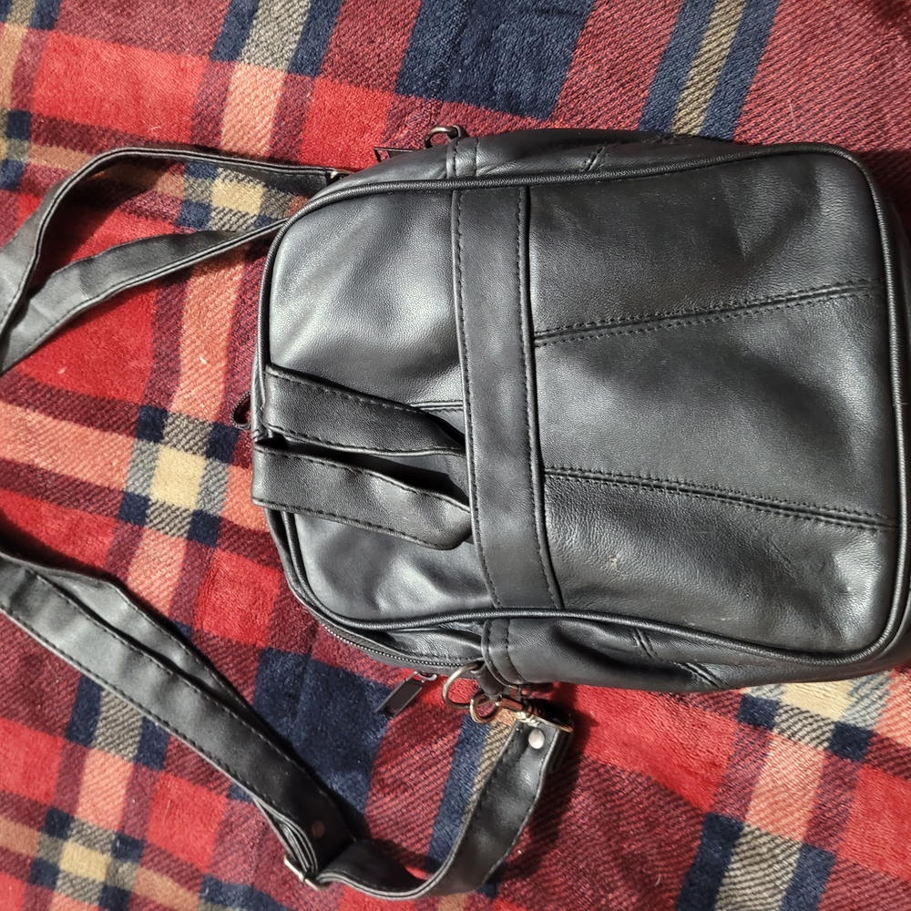 Black Leather Backpack with Adjustable Strap and Casual Design